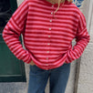 Model wearing the Hailey Red Combo striped cardigan styled with casual denim.