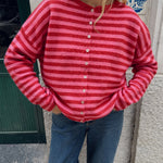 Model wearing the Hailey Red Combo striped cardigan styled with casual denim.