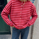 Model wearing the Hailey Red Combo striped cardigan styled with casual denim.