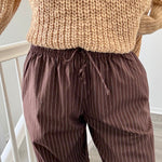 Close-up of Hallie Pinstripe Wide Leg Pants in Chocolate showing pinstripe fabric and elastic drawstring waist
