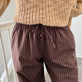 Close-up of Hallie Pinstripe Wide Leg Pants in Chocolate showing pinstripe fabric and elastic drawstring waist