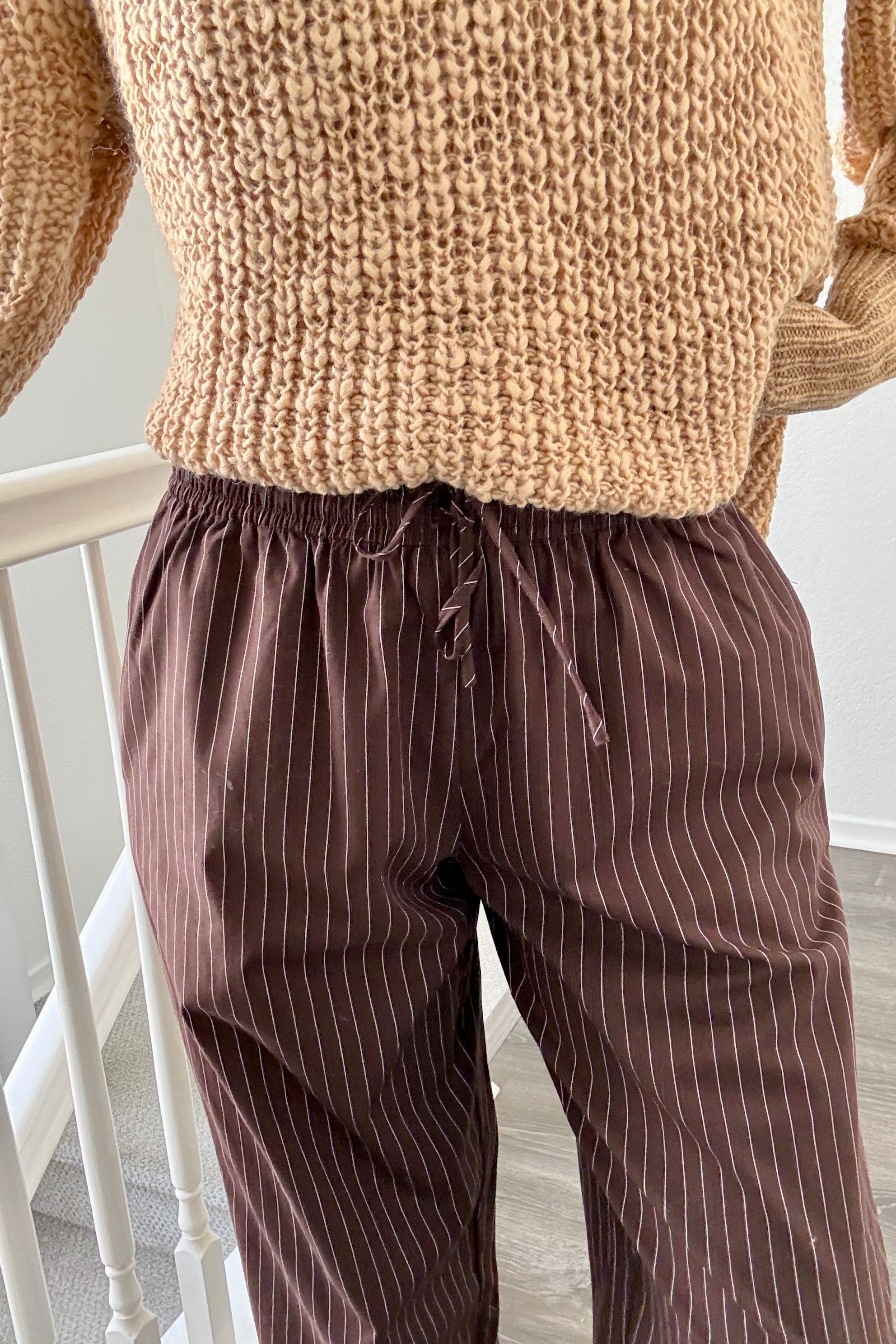 Close-up of Hallie Pinstripe Wide Leg Pants in Chocolate showing pinstripe fabric and elastic drawstring waist