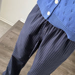 Close-up of Hallie Pinstripe Wide Leg Pants in Navy showing pinstripe fabric and elastic drawstring waist