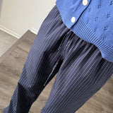 Close-up of Hallie Pinstripe Wide Leg Pants in Navy showing pinstripe fabric and elastic drawstring waist