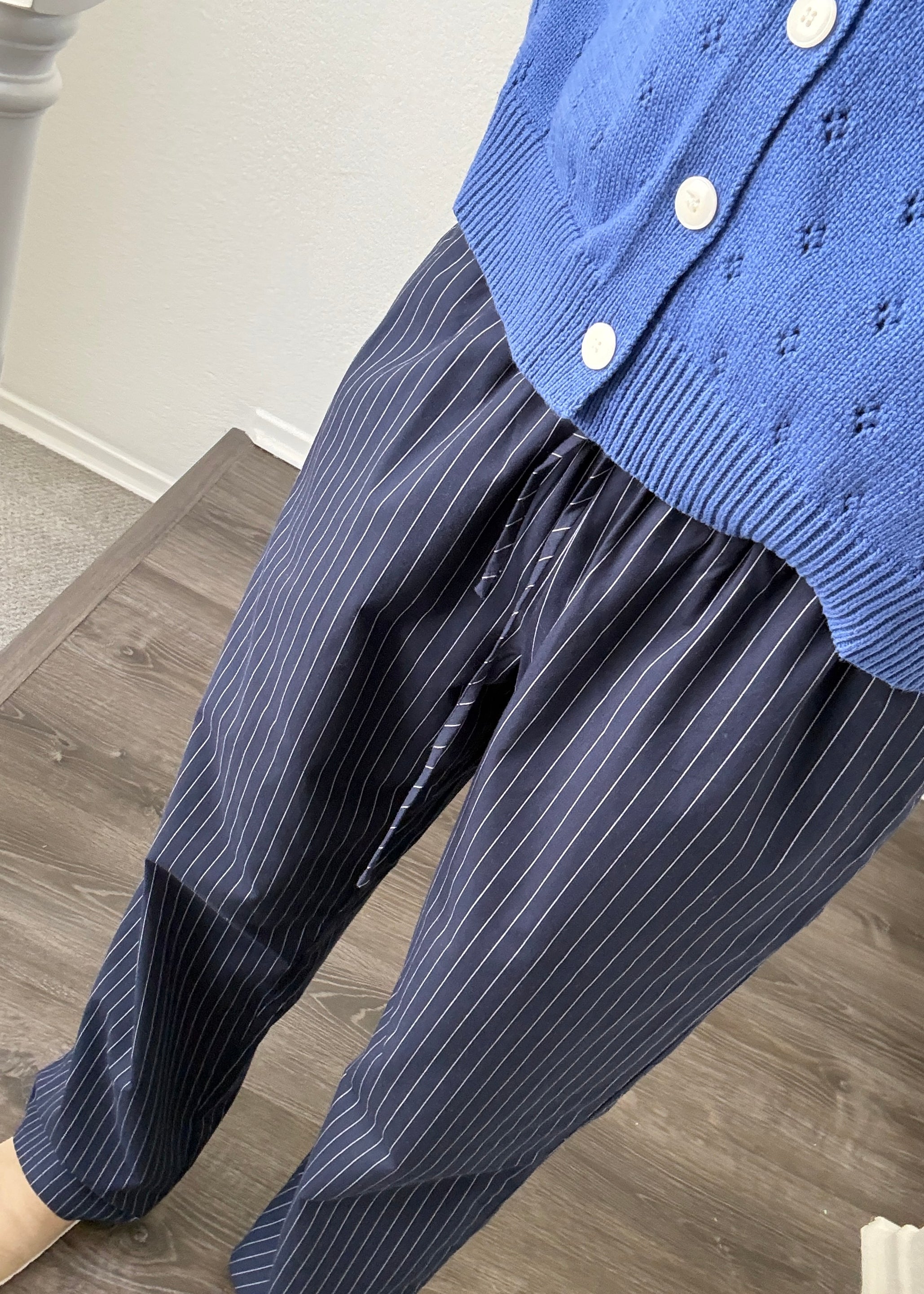 Close-up of Hallie Pinstripe Wide Leg Pants in Navy showing pinstripe fabric and elastic drawstring waist