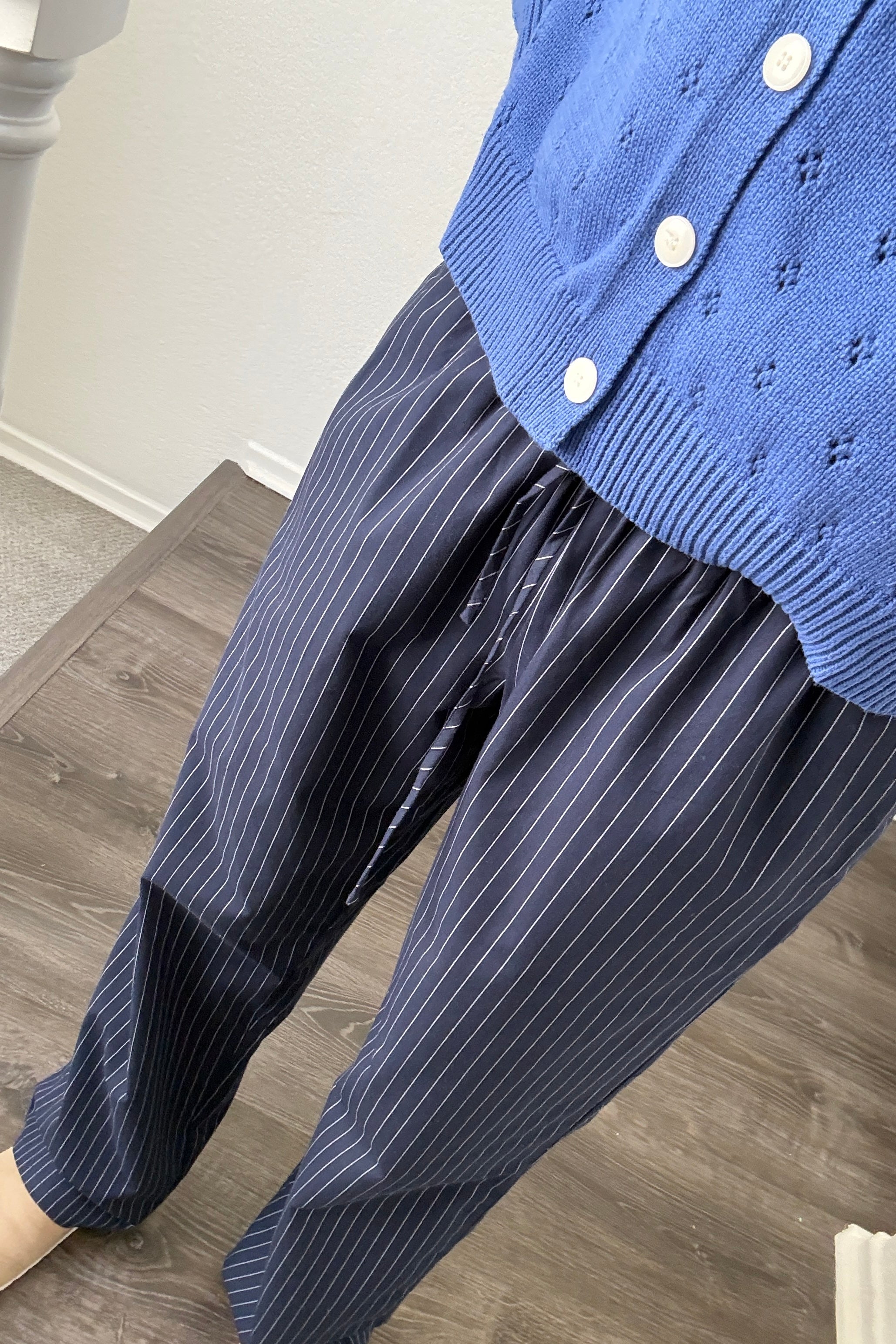 Close-up of Hallie Pinstripe Wide Leg Pants in Navy showing pinstripe fabric and elastic drawstring waist