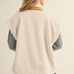 Back view of the ecru cozy snap vest showing the sleeveless silhouette and relaxed fit