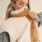 Close-up of the mock neck and snap-front detail on the Harper Cozy Snap Vest in ecru