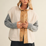 Front lifestyle view of model wearing the Harper Cozy Snap Vest in ecru with mock neck and snap closure