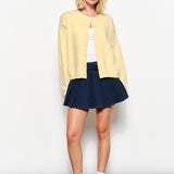 Full view of the Harper Round-Neck Relaxed Cardigan in butter yellow — soft, cozy knit with slightly oversized silhouette.