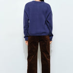 Back of the Harper Round-Neck Relaxed Cardigan in navy — relaxed knit texture with ribbed cuffs and hem.