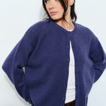 Woman wearing the Harper Round-Neck Relaxed Cardigan in navy — casual, cozy and cute  women’s knit cardigan.