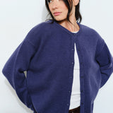 Woman wearing the Harper Round-Neck Relaxed Cardigan in navy — casual, cozy and cute  women’s knit cardigan.