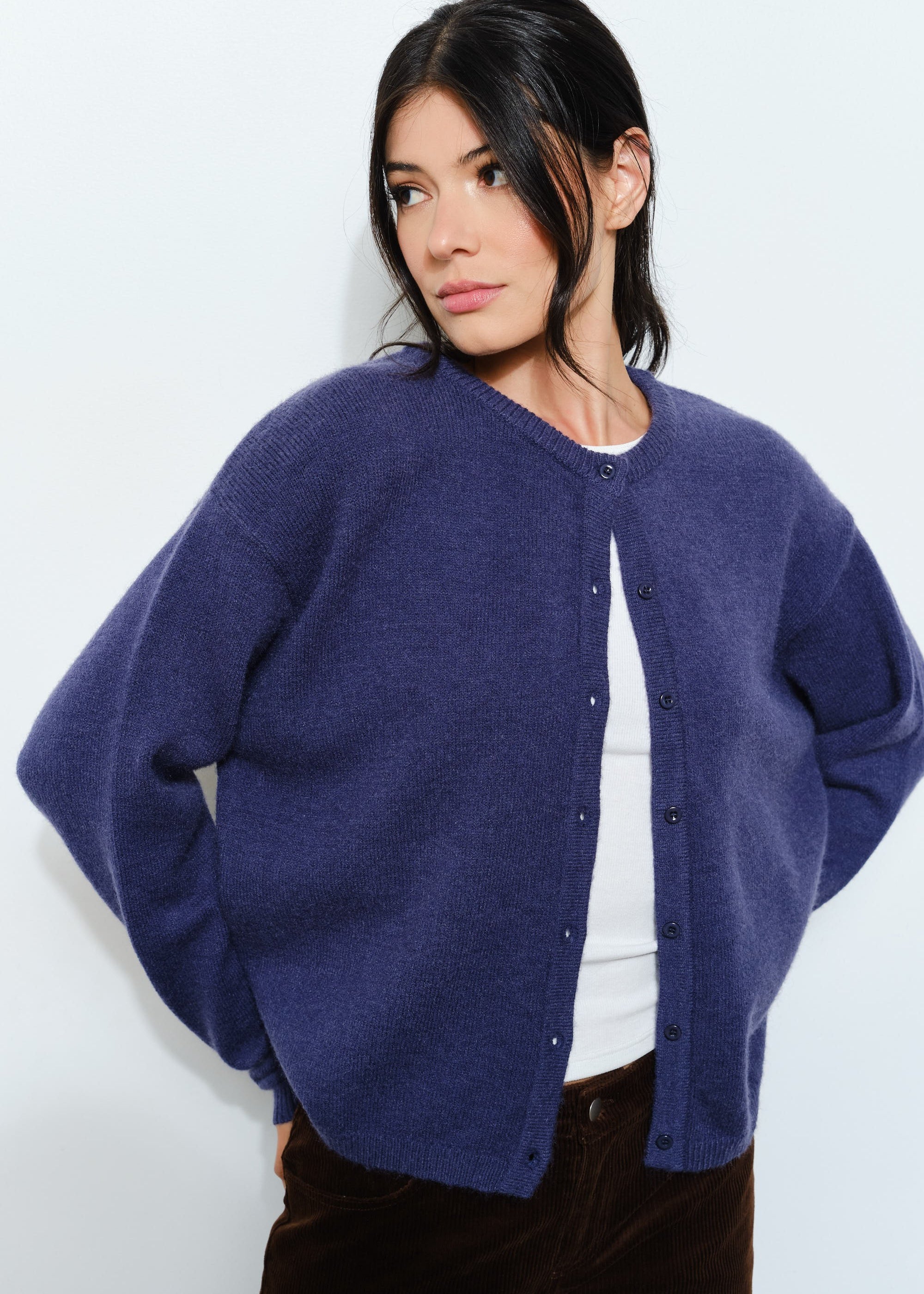 Woman wearing the Harper Round-Neck Relaxed Cardigan in navy — casual, cozy and cute  women’s knit cardigan.