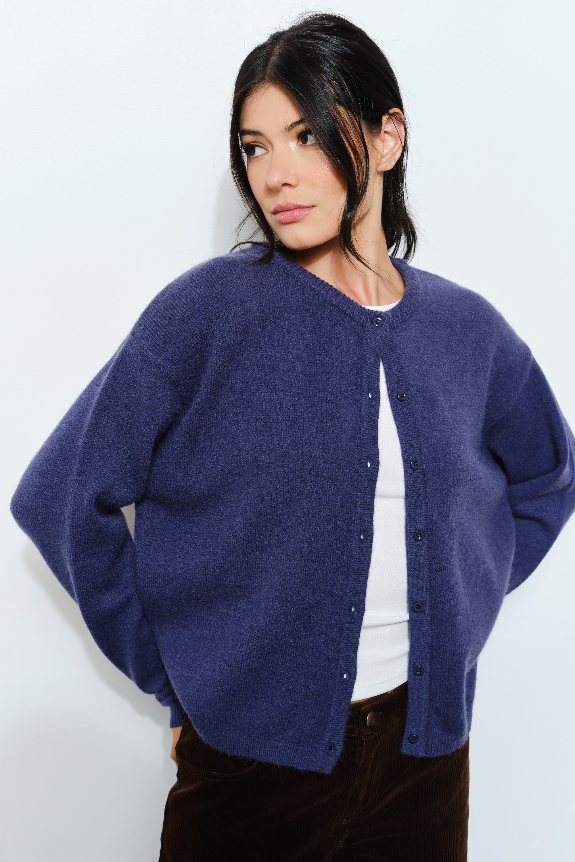 Woman wearing the Harper Round-Neck Relaxed Cardigan in navy — casual, cozy and cute  women’s knit cardigan.