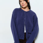 Woman wearing the Marley Harper Round-Neck Relaxed Cardigan in navy — lightweight knit with button-front closure and relaxed fit.