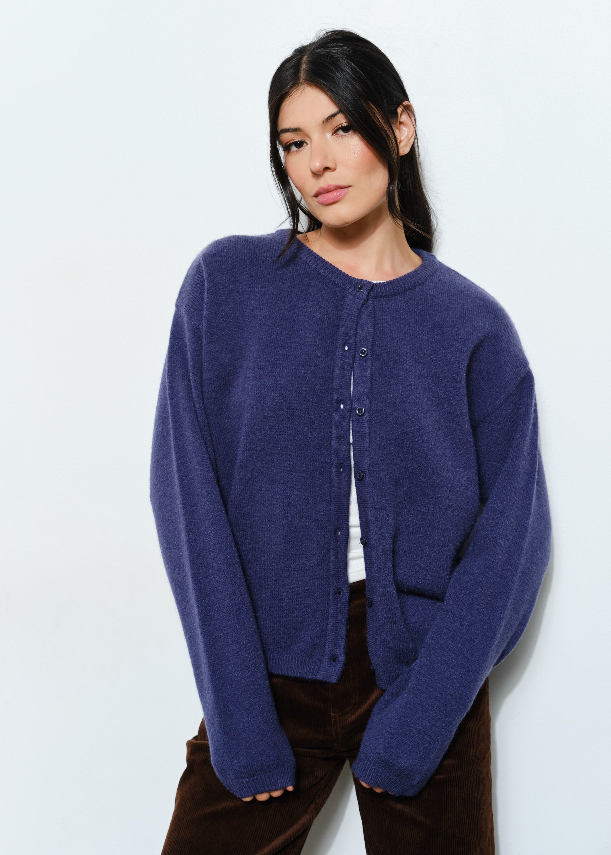 Woman wearing the Marley Harper Round-Neck Relaxed Cardigan in navy — lightweight knit with button-front closure and relaxed fit.