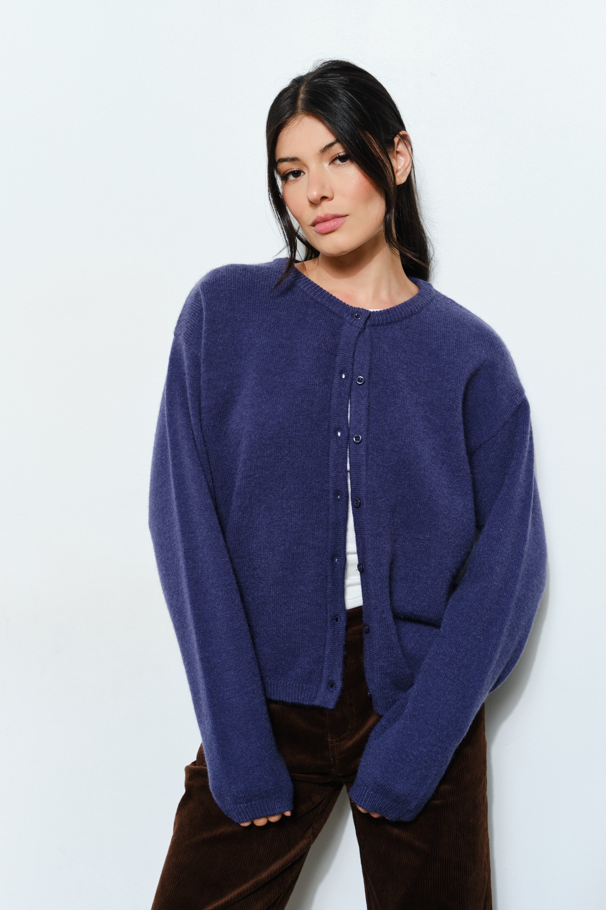 Woman wearing the Marley Harper Round-Neck Relaxed Cardigan in navy — lightweight knit with button-front closure and relaxed fit.