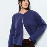 Model is wearing Marley Harper Round-Neck Relaxed Cardigan in navy — lightweight knit with button-front closure and round neck