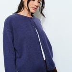 Side view of the Harper Round-Neck Relaxed Cardigan in navy — soft, cute cozy knit with an oversized silhouette.