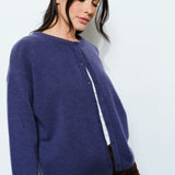 Side view of the Harper Round-Neck Relaxed Cardigan in navy — soft, cute cozy knit with an oversized silhouette.
