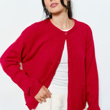 Woman wearing the Marley Harper Round-Neck Relaxed Cardigan in red - lightweight knit with button-front design and relaxed fit.