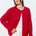 Woman wearing the Marley Harper Round-Neck Relaxed Cardigan in red - lightweight knit with button-front design and relaxed fit.