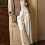Champagne satin lace wide-leg pants styled in a vintage-inspired lifestyle outfit