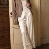 Champagne satin lace wide-leg pants styled in a vintage-inspired lifestyle outfit