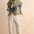 Olive green oversized puffer vest on model, full front view
