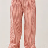 Irene Striped Wide Leg Pants in Blush front view showing the elastic waistband, button closure, front pleats, and wide leg fit.