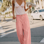 Irene Striped Wide Leg Pants in Blush styled in a casual everyday outfit with a relaxed wide leg fit.