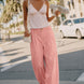 Irene Striped Wide Leg Pants in Blush styled in a casual everyday outfit with a relaxed wide leg fit.