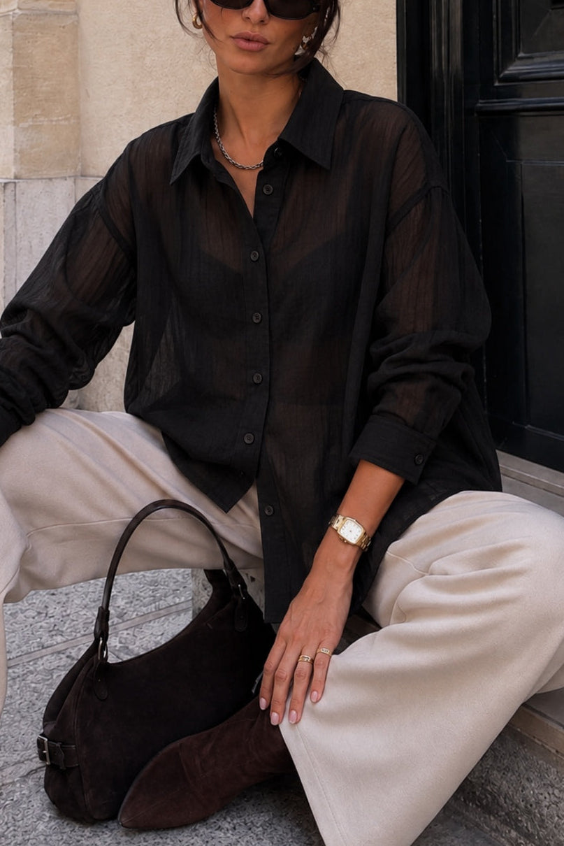 Side view of woman wearing the relaxed sheer pinstripe button-down shirt