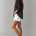Side view of Isabella relaxed sheer pinstripe shirt in charcoal black