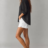 Side view of Isabella relaxed sheer pinstripe shirt in charcoal black