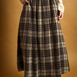 Front view of Ives plaid A-line maxi skirt with drawstring waist and pockets