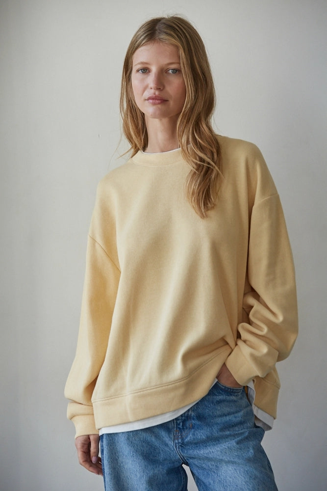 Front view of the Jetset butter yellow layered crewneck sweatshirt with white contrast trim at the neckline and hem.