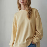 Front view of the Jetset butter yellow layered crewneck sweatshirt with white contrast trim at the neckline and hem.