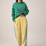 full outfit - model is wearing  butter yellow Landon Track Pants showing elastic waist