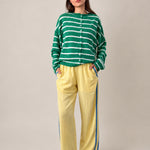 Full outfit of butter yellow Landon Track Pants showing the blue stripe detail and relaxed pull-on fit.