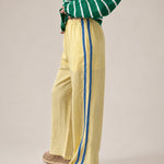 Side view of  butter Landon Track Pants 
