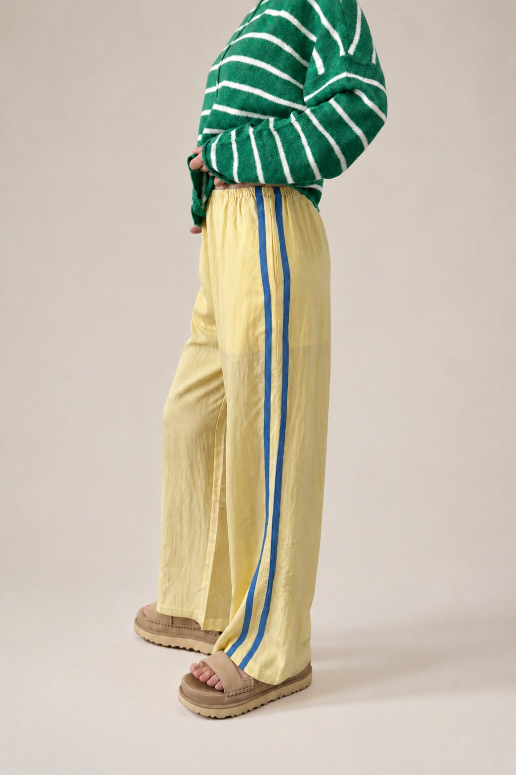 Side view of  butter Landon Track Pants 