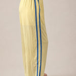 Side view of butter yellow Landon Track Pants 