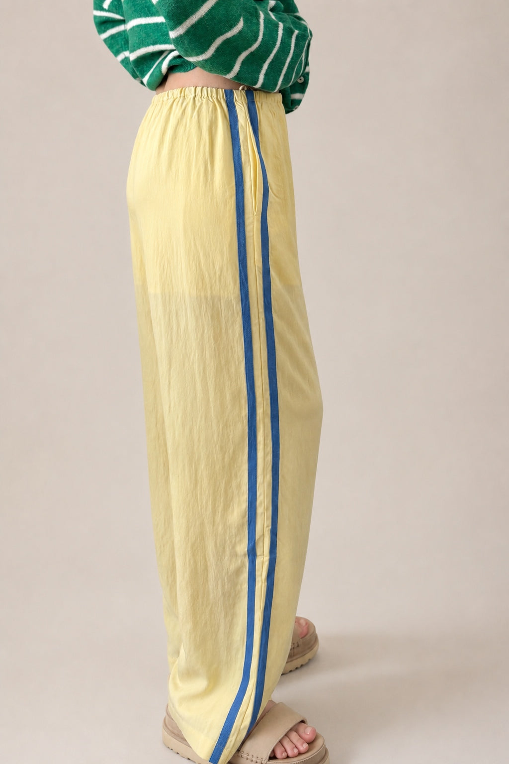 Side view of butter yellow Landon Track Pants 