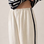Close-up of the ivory Landon Track Pants with soft elastic waistband and easy pull-on design.