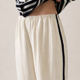 Close-up of the ivory Landon Track Pants with soft elastic waistband and easy pull-on design.