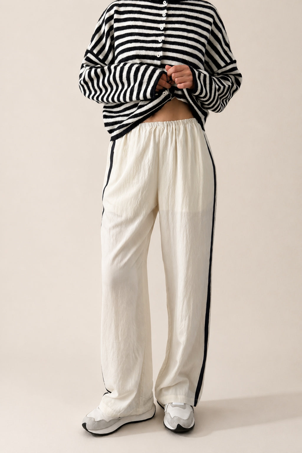Landon Side Stripe Track Pants in ivory with relaxed wide leg fit, elastic waist, and blue side stripe detail.