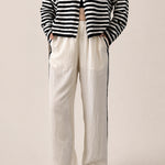 Landon Side Stripe Track Pants in ivory with relaxed wide leg fit, elastic waist, and blue side stripe detail - front view