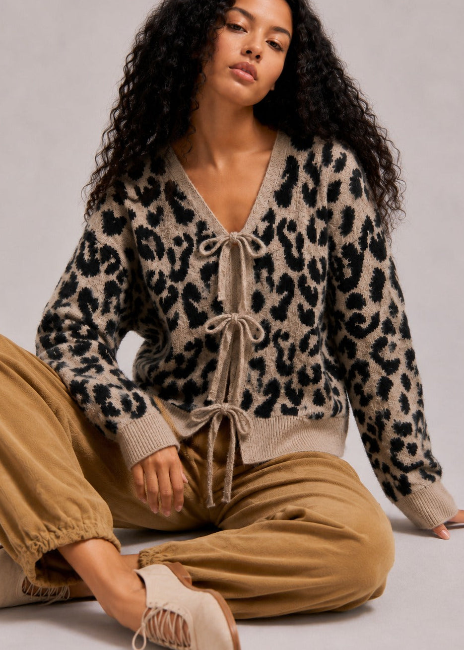 Front view of the mocha black leopard print cardigan sweater with long sleeves and a relaxed fit